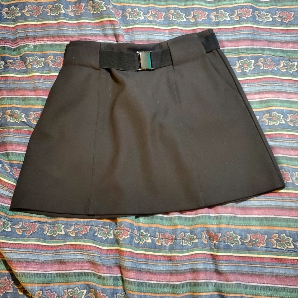 Black back zip above the knee skirt.